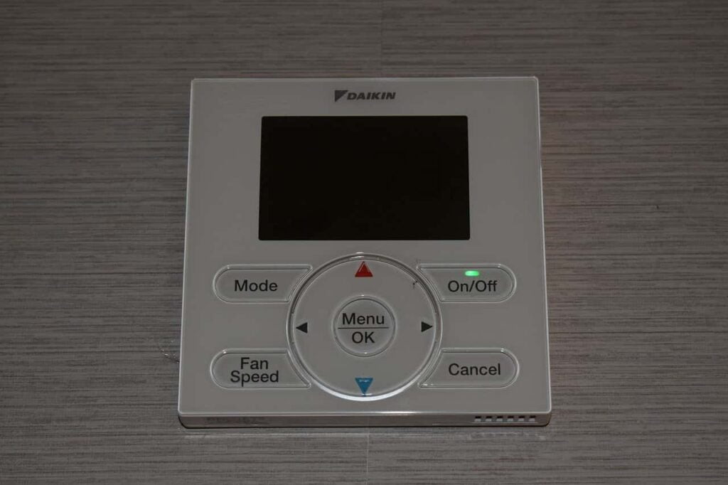 daikin digital display thermostat with multiple buttons